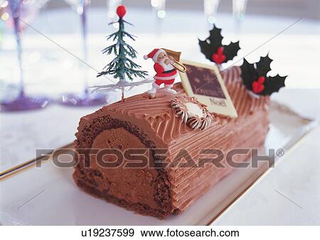 Stock Photo - Christmas cake rolled up and covered with chocolate cream, Yolu log . Fotosearch