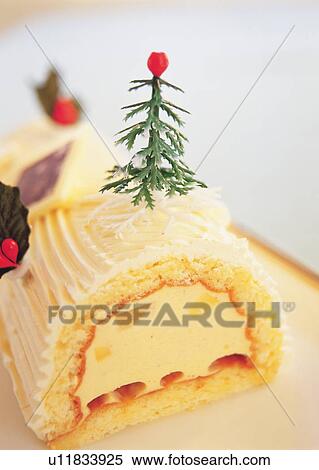 Stock Photography - Christmas cake rolled up and covered with cream, Yolu log . Fotosearch