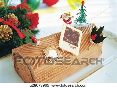 Christmas cake rolled up and covered with chocolate cream, Yolu log View Large Photo Image Stock Photography - Christmas cake rolled up and covered with chocolate cream, Yolu log . Fotosearch