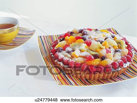 Fruit tart and a cup of tea on table View Large Photo Image Stock Photo - Fruit tart and a cup of tea on table. Fotosearch