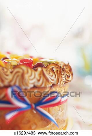 Stock Image - Fruitcake wrapped by ribbon. Fotosearch