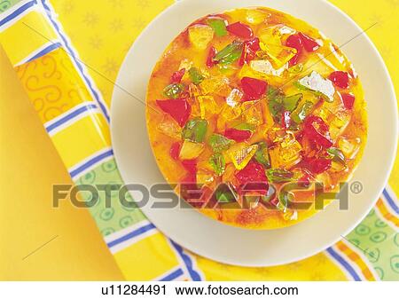 Stock Image - Mousse cake covered with jelly on plate. Fotosearch