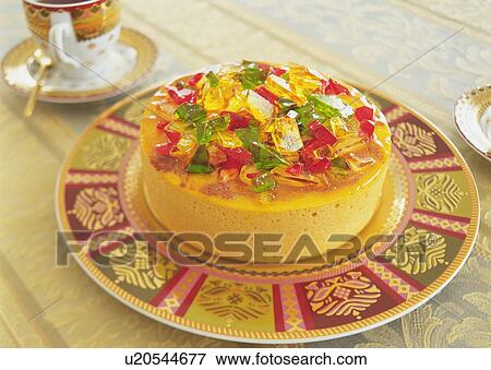 Stock Photo - Mousse cake covered with jelly on plate. Fotosearch