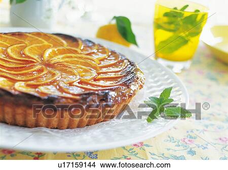 Picture - Orange tart on plate. Fotosearch