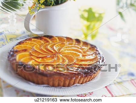 Stock Image - Orange tart on plate. Fotosearch
