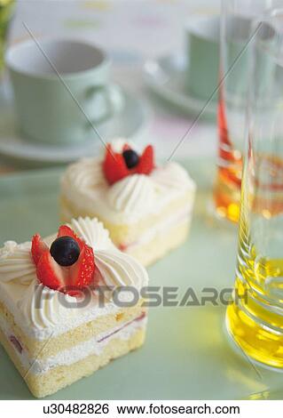 Slices of strawberry cake with whipped cream View Large Photo Image Stock Photograph - Slices of strawberry cake with whipped cream. Fotosearch