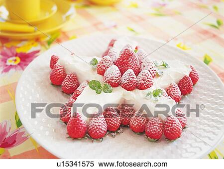 Stock Photography - Star shaped cake with cream and strawberry. Fotosearch