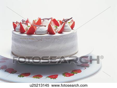 Stock Photography - Strawberry cake with whipped cream on cakestand. Fotosearch