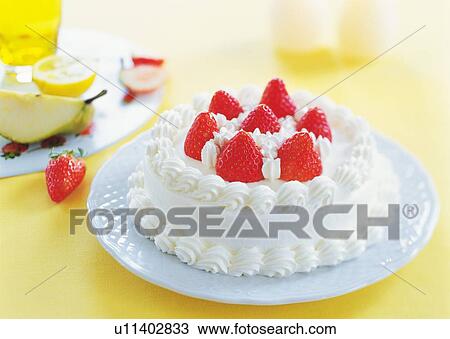 Stock Image - Strawberry cake with whipped cream. Fotosearch
