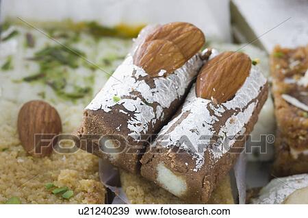 Close-up of a chocolate roll with milk cake View Large Photo Image Stock Photo - Close-up of a chocolate roll with milk cake. Fotosearch
