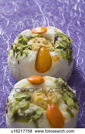 Stock Photo - Close-up of Bengali sweet garnished with Almond and Pistachio. Fotosearch