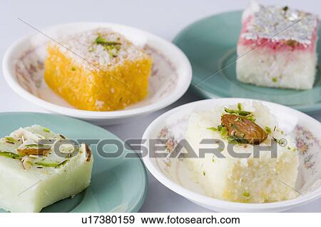 Stock Photo - Close-up of Burfi in a saucer. Fotosearch
