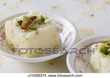 Picture - Close-up of Burfi in bowl. Fotosearch