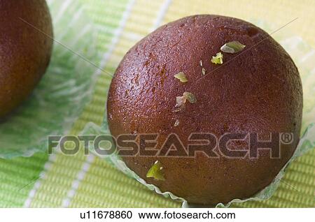 Stock Image - Close-up of Gulab Jamun. Fotosearch