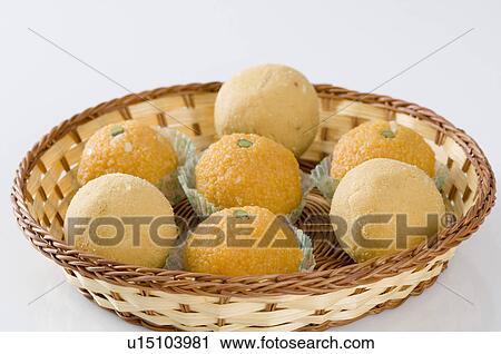 Close-up of Ladoos in a basket View Large Photo Image Stock Image - Close-up of Ladoos in a basket. Fotosearch