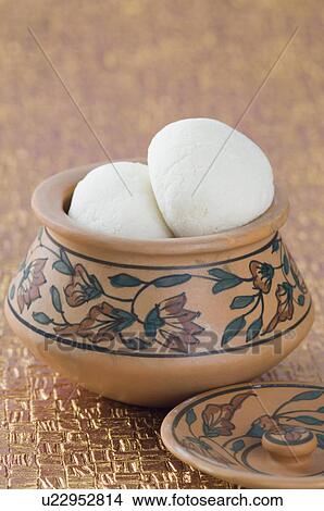 Picture - Close-up of sponge Rasgullas in a bowl. Fotosearch