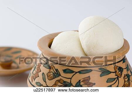 Stock Photo - Close-up of sponge Rasgullas in a bowl. Fotosearch