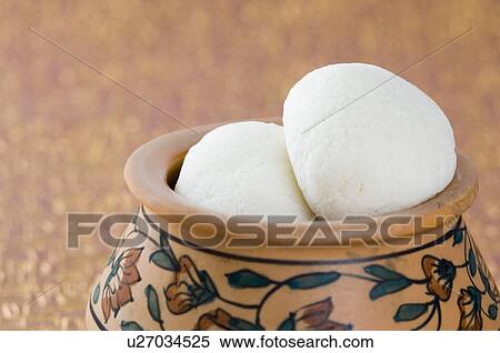 Stock Photography - Close-up of sponge Rasgullas in a bowl. Fotosearch