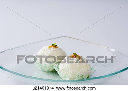 Close-up of two Rasgullas in a plate View Large Photo Image Picture - Close-up of two Rasgullas in a plate. Fotosearch