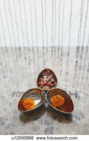 High angle view of a marigold flowers with spices in bowls View Large Photo Image Stock Photo - High angle view of a marigold flowers with spices in bowls. Fotosearch