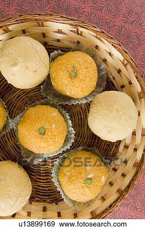 High angle view of Ladoos in a basket View Large Photo Image Stock Photo - High angle view of Ladoos in a basket. Fotosearch