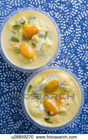 Stock Image - High angle view of sweet food in two cups. Fotosearch