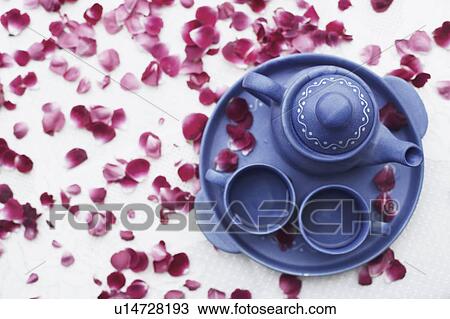 Stock Image - High angle view of tea set on the table. Fotosearch