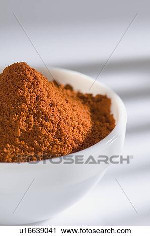 Stock Image - Close-up of a bowl of Chilli powder. Fotosearch