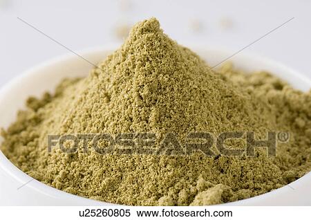 Stock Photography - Close-up of a bowl of Coriander powder. Fotosearch