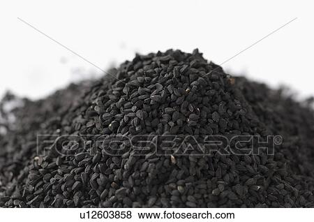 Stock Photo - Close-up of a heap of Black Caraway seeds. Fotosearch