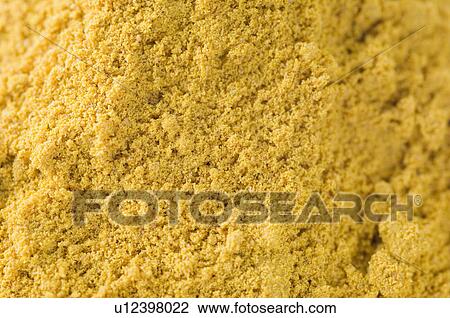 Stock Image - Close-up of Coriander powder. Fotosearch