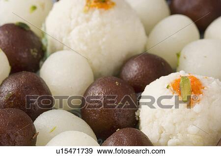 Close-up of Gulab Jamuns and Rasgullas View Large Photo Image Stock Photo - Close-up of Gulab Jamuns and Rasgullas. Fotosearch