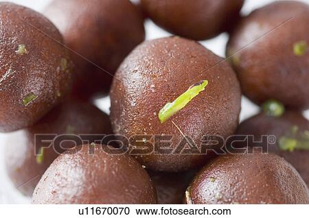 Stock Image - Close-up of Gulab Jamuns. Fotosearch