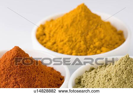 Stock Image - Close-up of three bowls of spices. Fotosearch