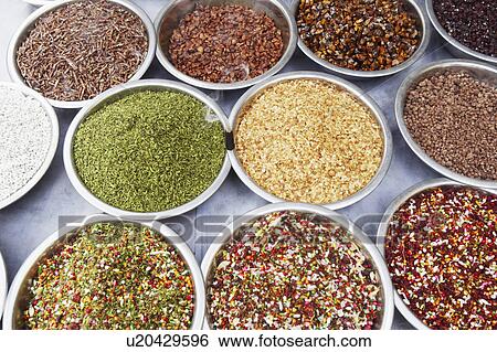 Stock Photograph - High angle view of assorted spices at a spice stall. Fotosearch