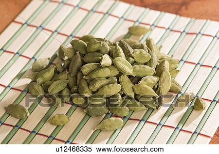 Stock Photography - High angle view of Cardamoms on a place mat. Fotosearch