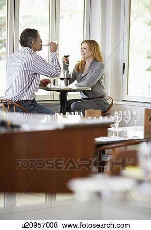 Stock Photo - Couple tasting red wines. Fotosearch