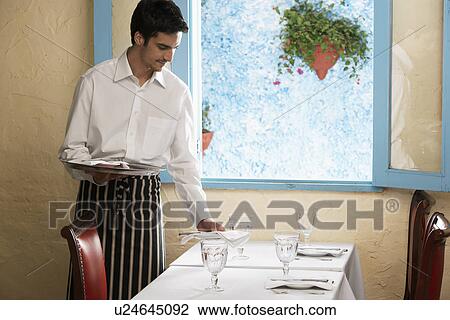 Waiter laying table View Large Photo Image Stock Image - Waiter laying table. Fotosearch