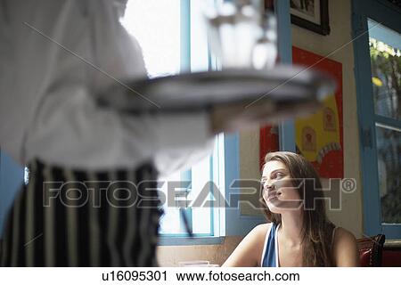 Waiter near female customer View Large Photo Image Stock Image - Waiter near female customer. Fotosearch