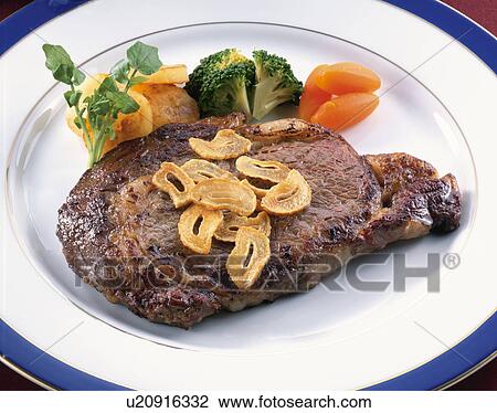 Stock Image - Garlic Steak. Fotosearch