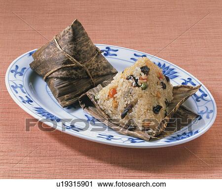 Chinese Rice Dumpling Wrapped In Bamboo Leaves View Large Photo Image Stock Image - Chinese Rice Dumpling Wrapped In Bamboo Leaves. Fotosearch