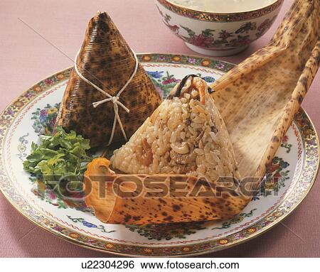 Chinese Rice Dumpling Wrapped In Bamboo Leaves View Large Photo Image Stock Photograph - Chinese Rice Dumpling Wrapped In Bamboo Leaves. Fotosearch
