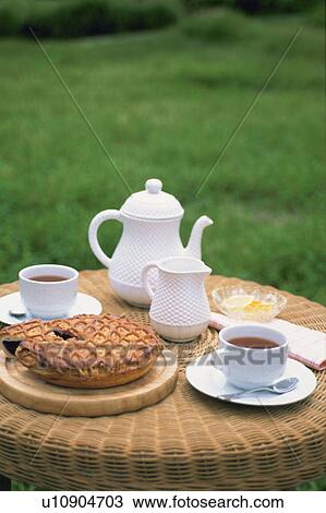 Stock Image - Teatime, Outdoors. Fotosearch