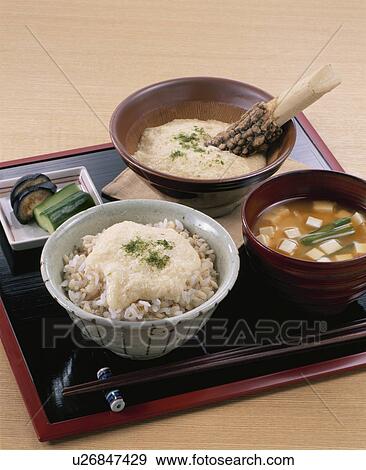 Stock Photo - Boiled Mixture Of Rice And Barley, Grated Yam. Fotosearch