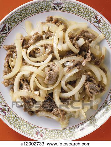 Stock Image - Stir-Fried Dishes Of New Onion And Beef. Fotosearch