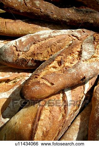 Stock Photograph - baguette, baked, bakery, beige, bread, brown. Fotosearch