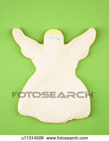Stock Photograph - Angel sugar cookie with decorative icing.. Fotosearch