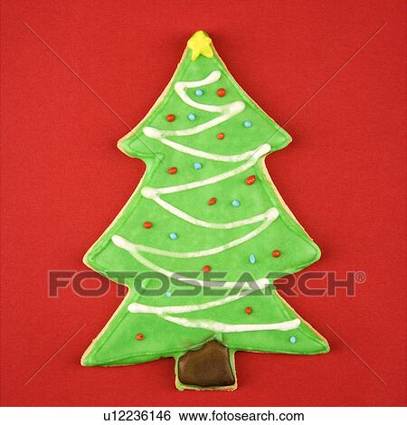 Stock Photograph - Christmas tree sugar cookie with decorative icing.. Fotosearch