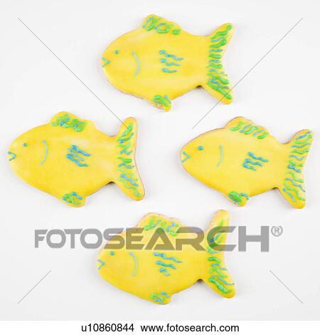 Four fish shaped sugar cookies with decorative icing. View Large Photo Image Picture - Four fish shaped sugar cookies with decorative icing.. Fotosearch