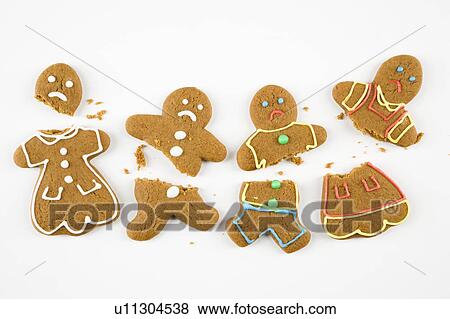 Four frowning male and female gingerbread cookies broken into pieces. View Large Photo Image Stock Photo - Four frowning male and female gingerbread cookies broken into pieces. . Fotosearch